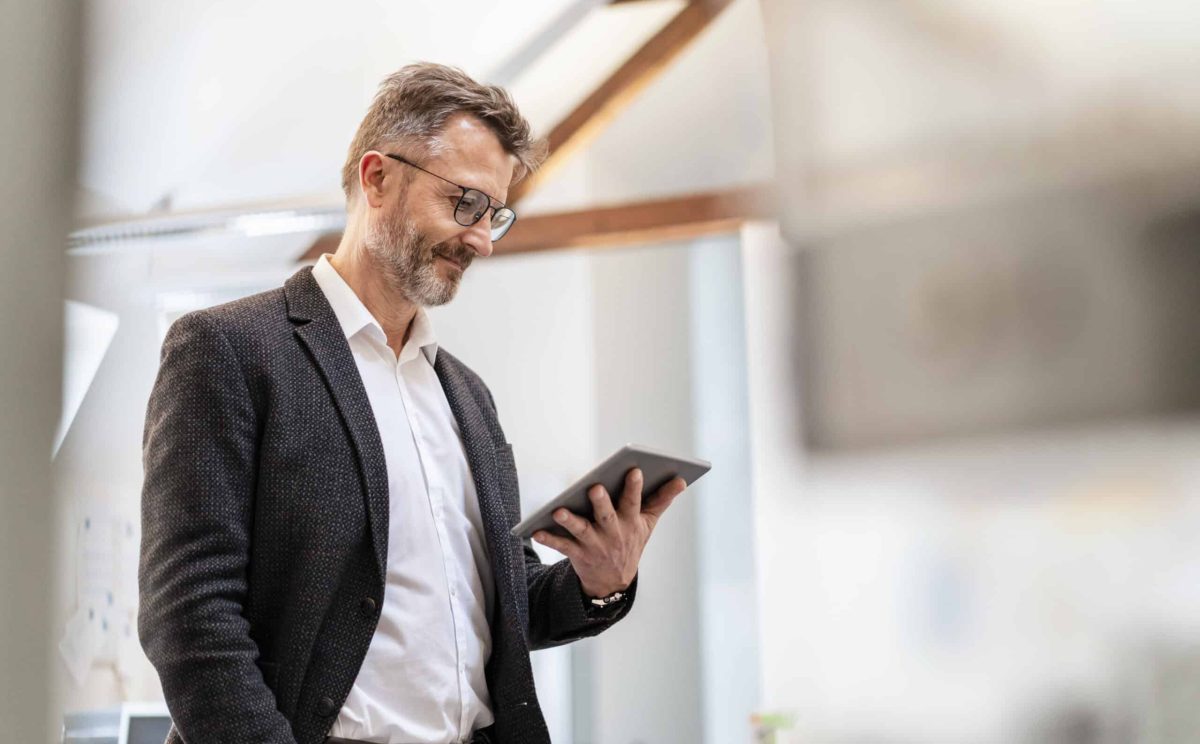 Businessman using tablet in office